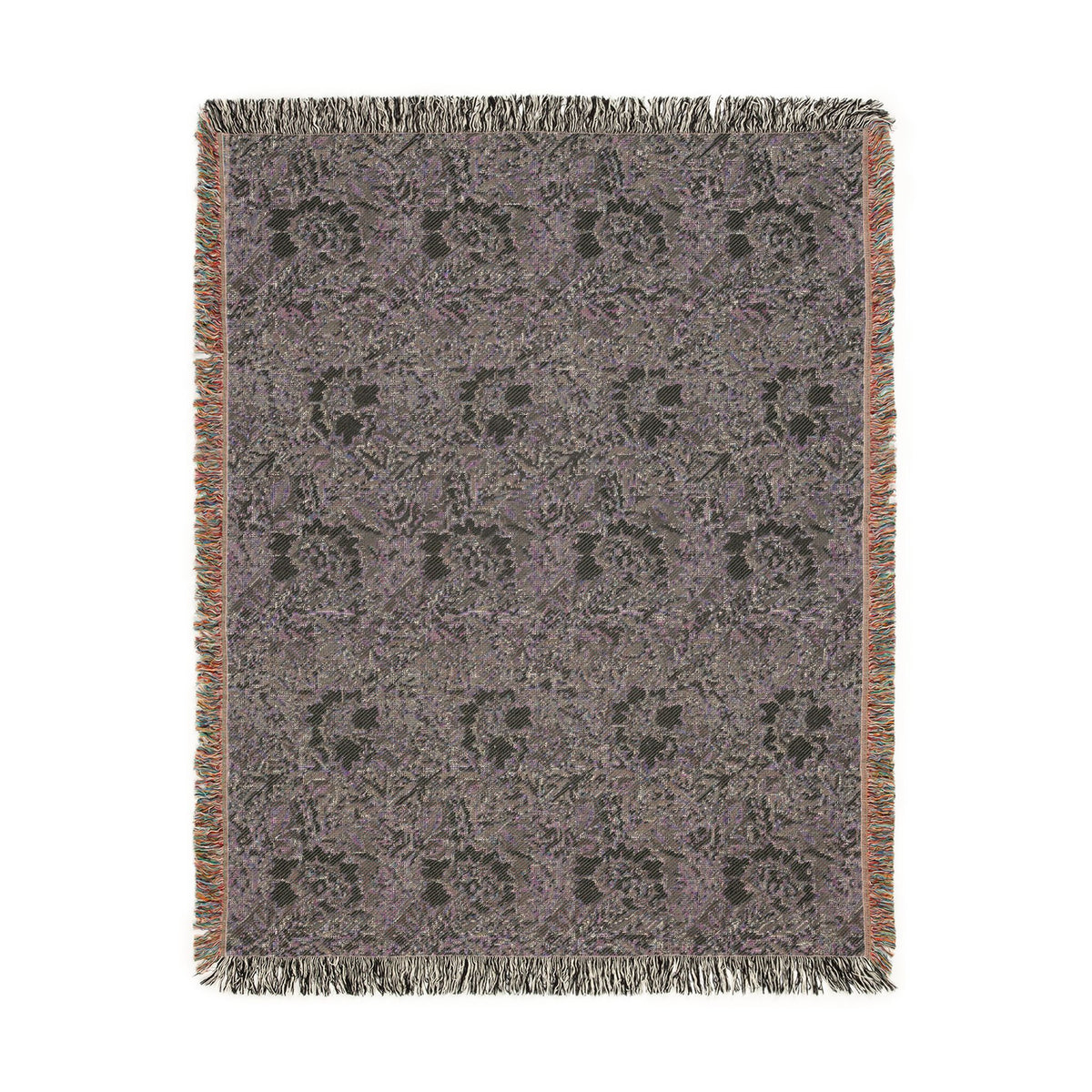 A rectangular woven throw blanket with fringed edges, featuring a muted purple and gray floral pattern with a warm brown border, shown flat against a white background.