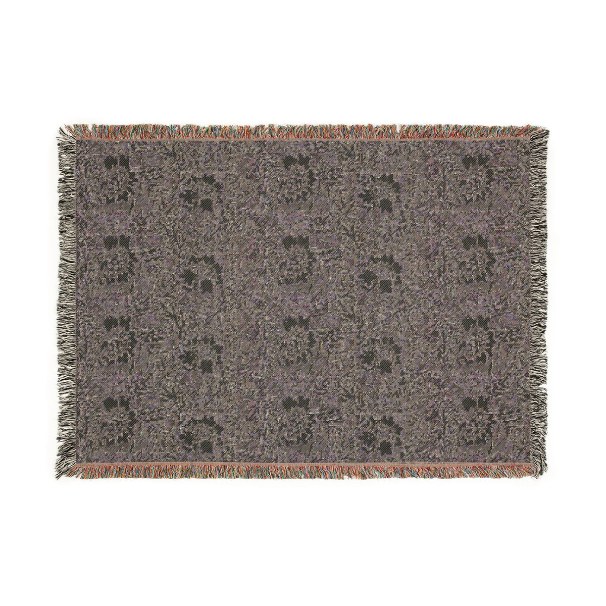 A rectangular woven throw blanket with fringed edges, featuring an abstract pattern of interwoven gray, purple, and black yarns with subtle orange accents along the fringe.