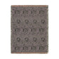 A rectangular woven throw blanket with a textured, heathered pattern in shades of purple, gray, and black, featuring a fringed border.