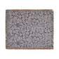 Floral patterned throw blanket with fringe on a white background