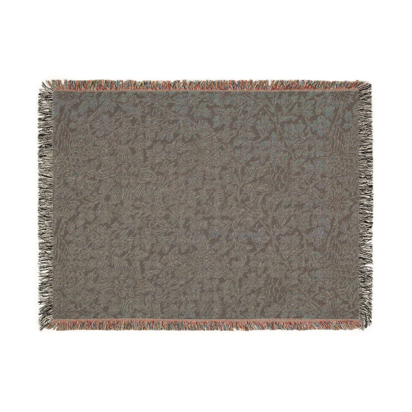 Textured woven blanket with fringe on a white background
