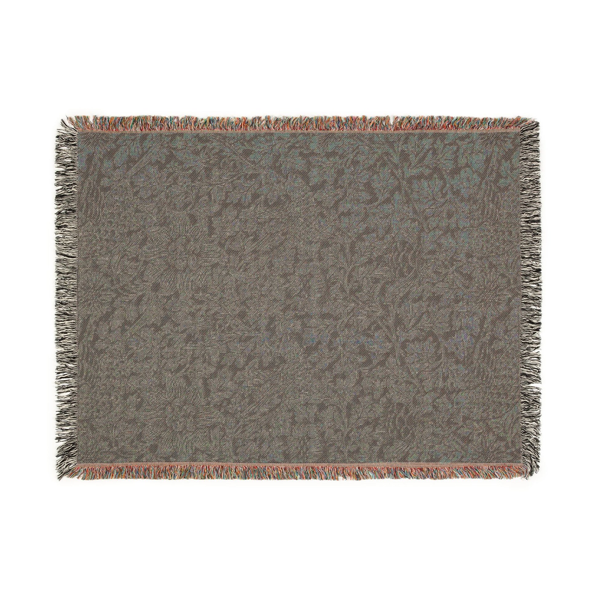 Textured woven blanket with fringe on a white background