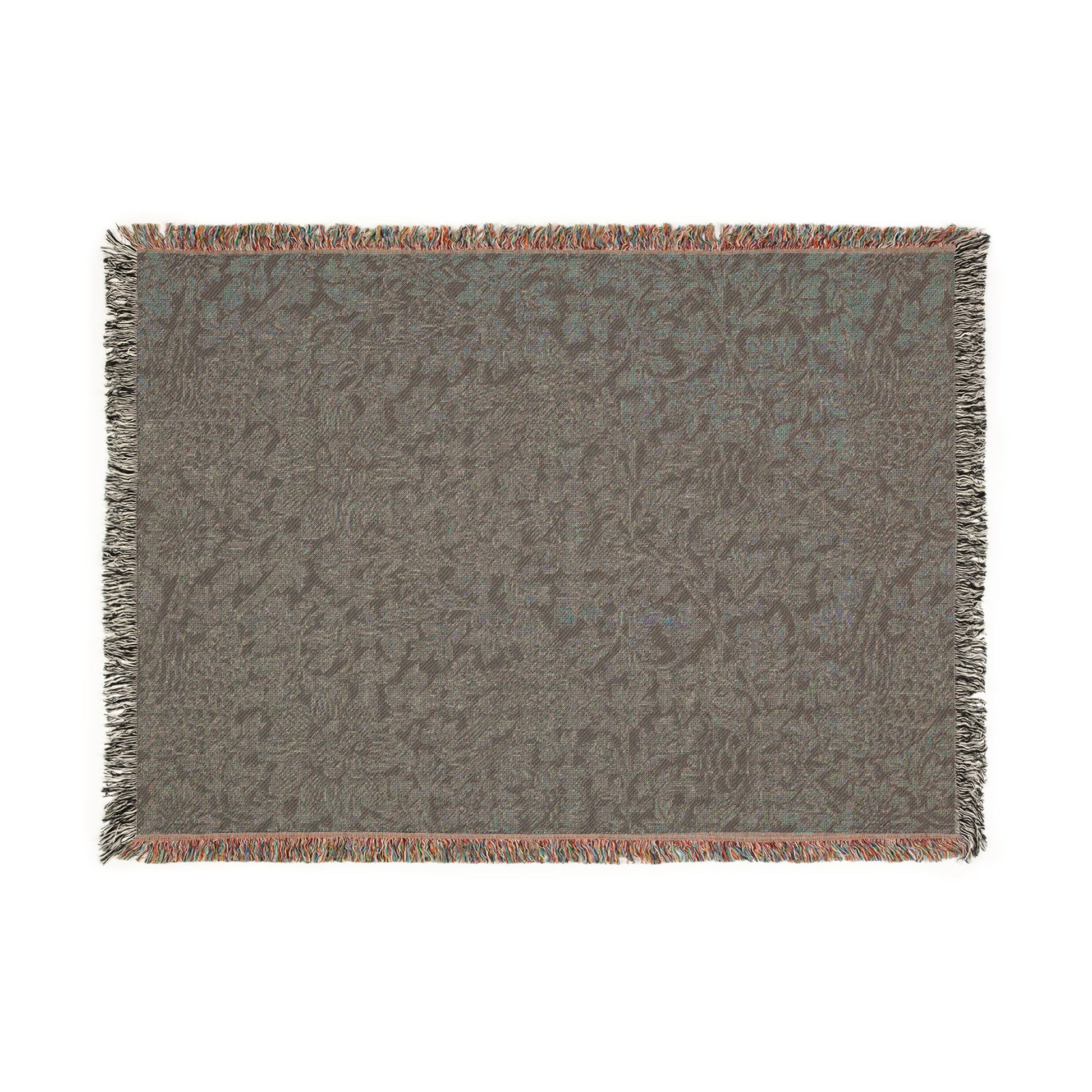 Textured gray rug with fringe on a white background