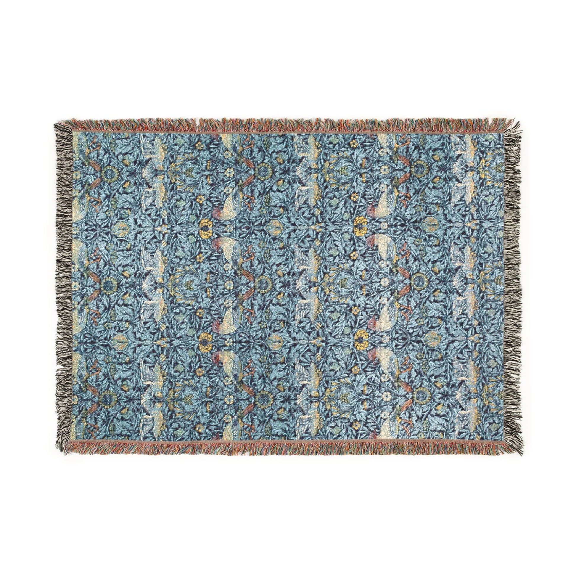 Decorative blue blanket with intricate patterns on a white background