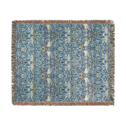 Decorative throw blanket with floral pattern on a white background