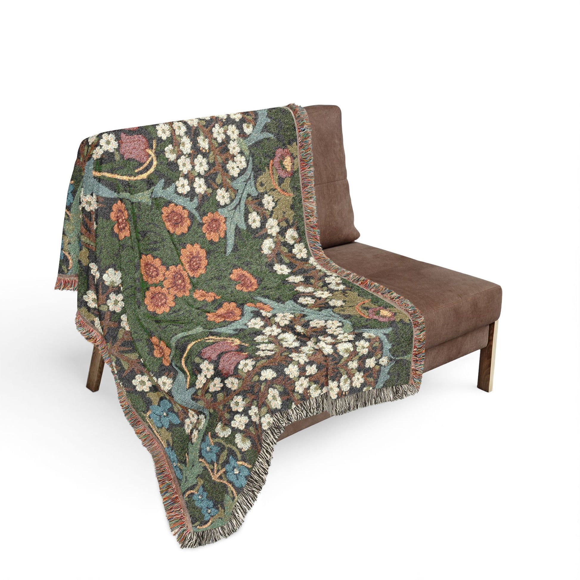 Floral patterned blanket draped over a brown chair on a white background