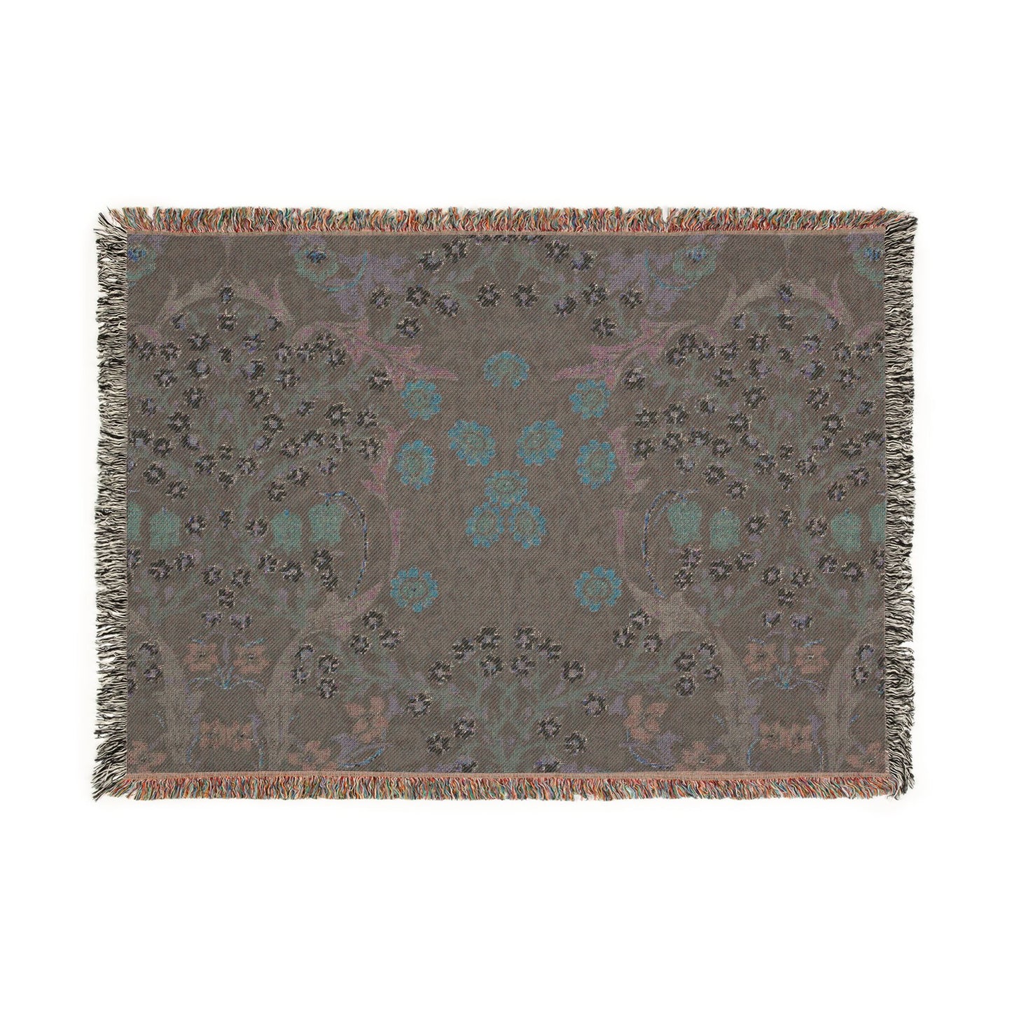 Decorative throw blanket with floral pattern on a plain background