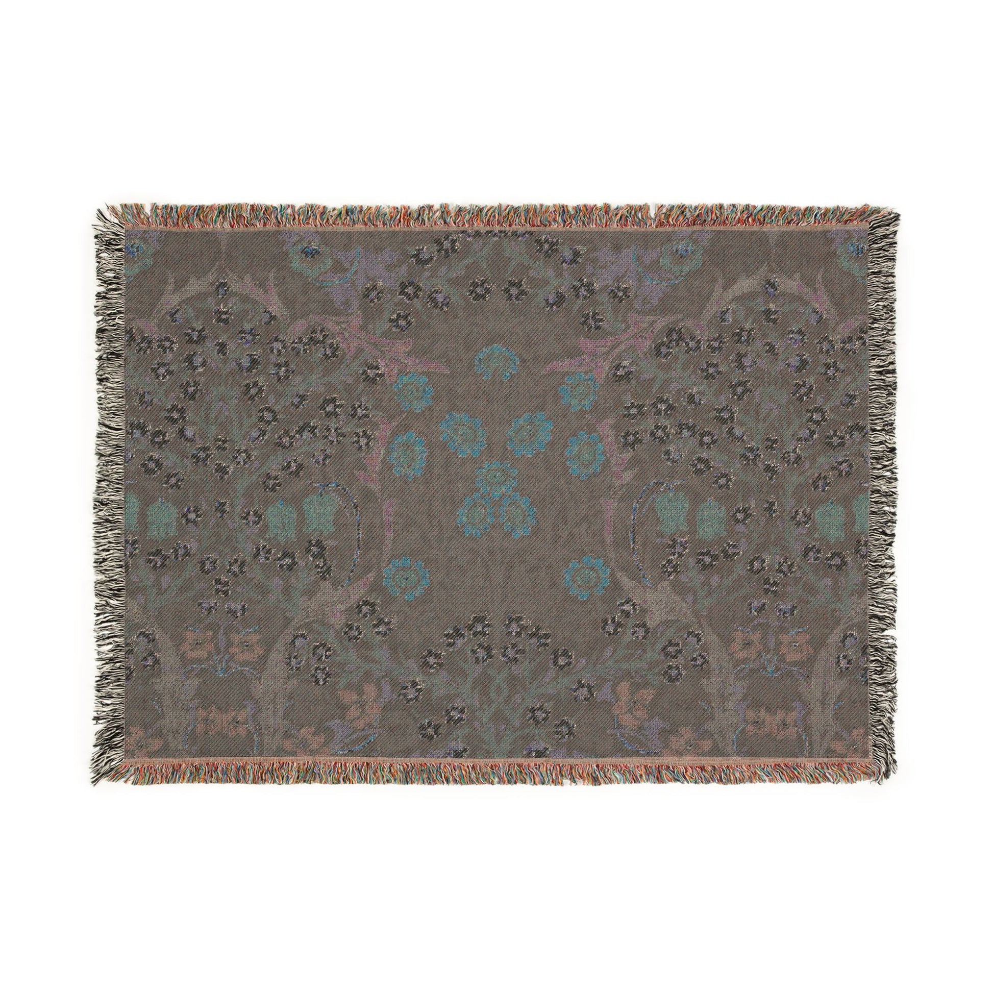 Decorative throw blanket with floral pattern on a plain background