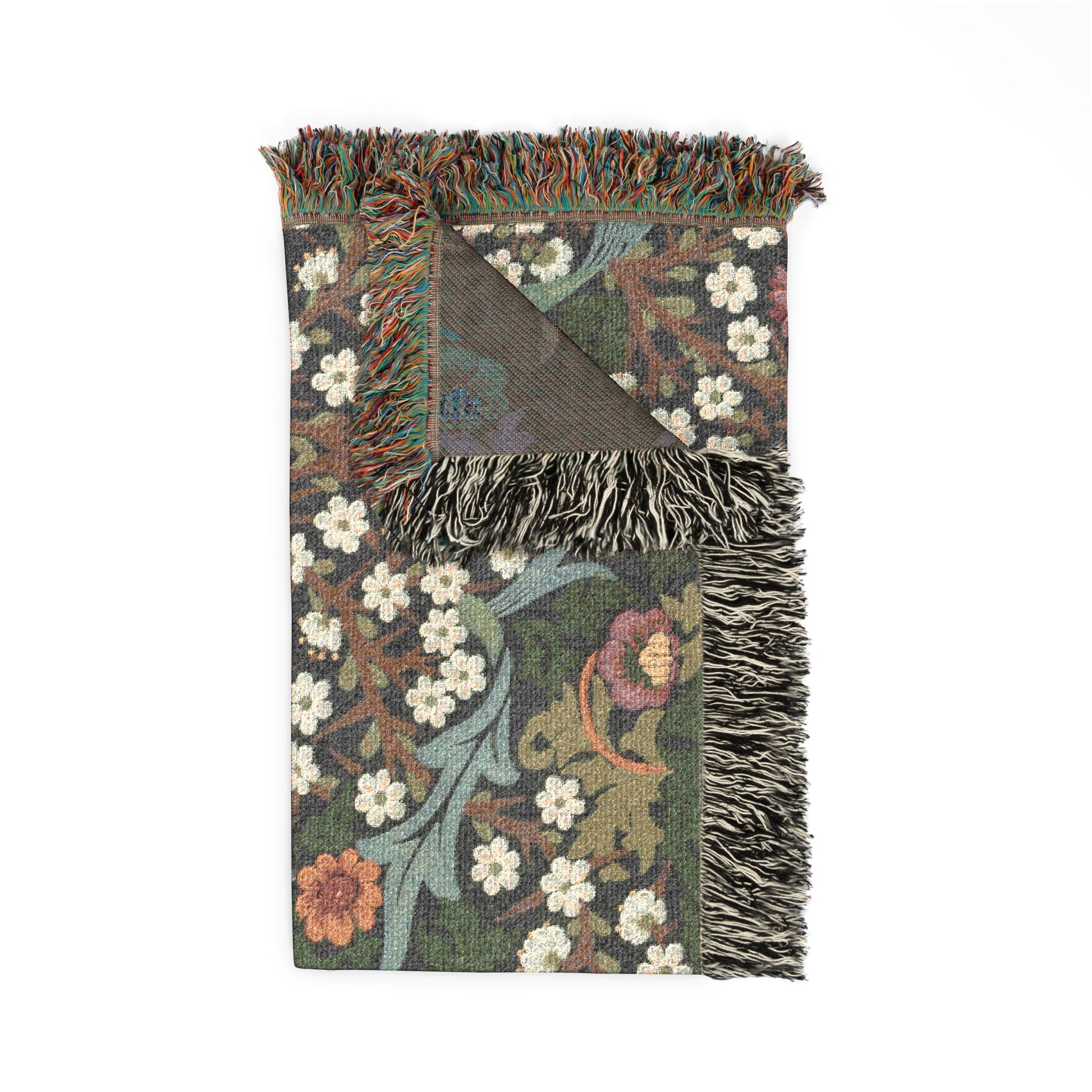 Floral patterned throw blanket with fringes on a white background