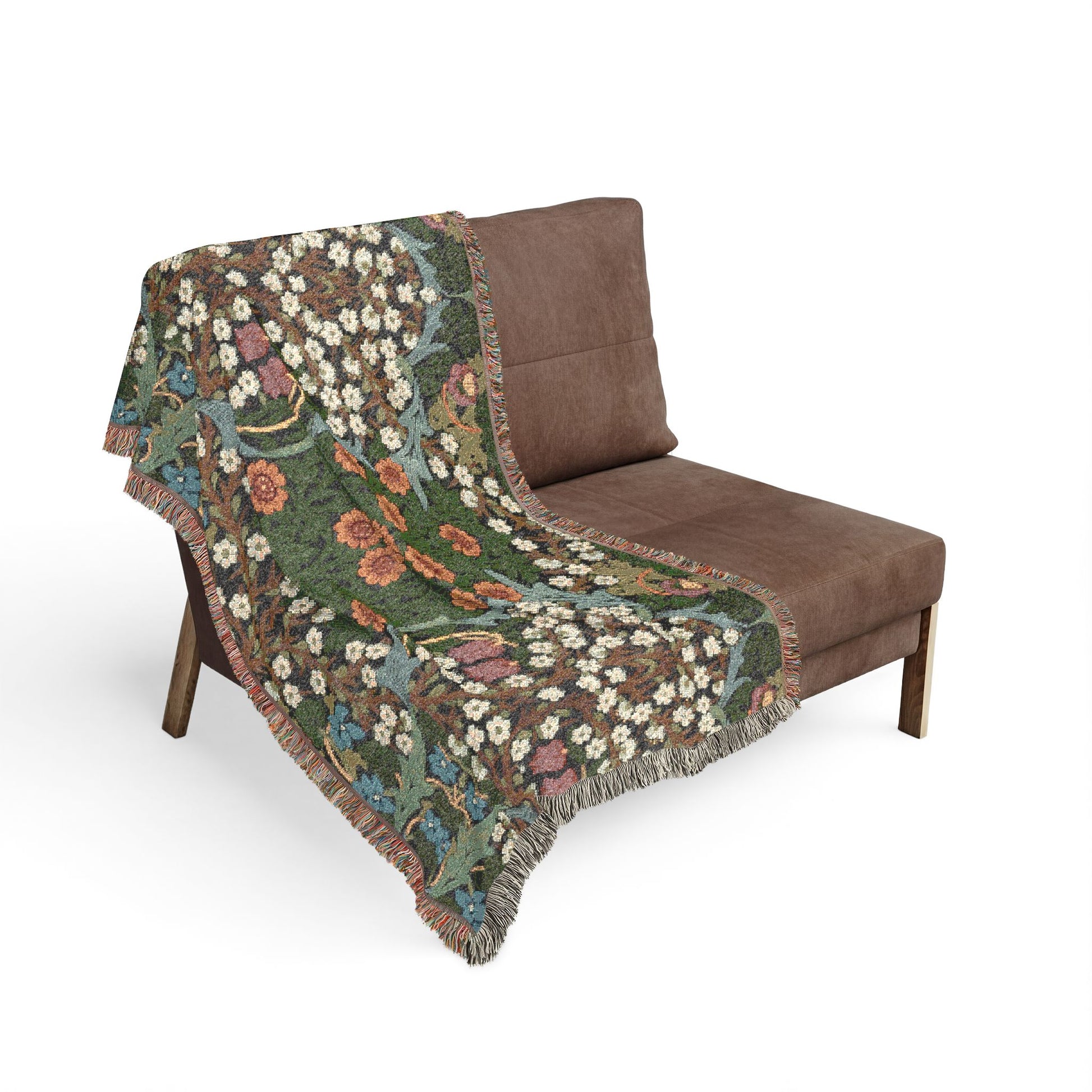 Floral-patterned blanket draped over a brown chair on a white background