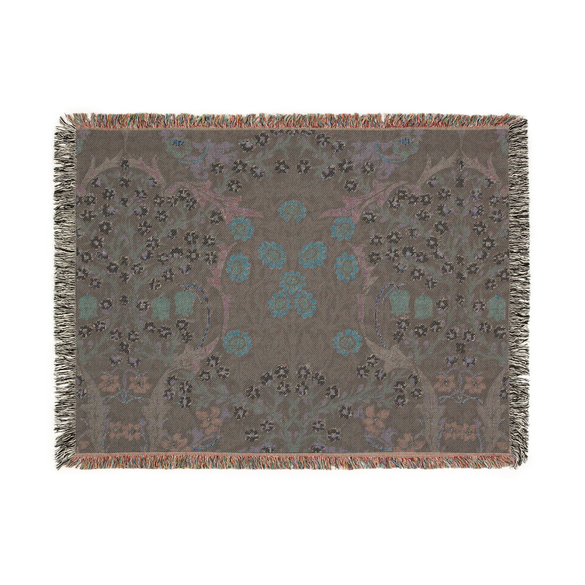 Decorative throw blanket with a floral pattern on a plain background