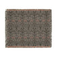 A woven cotton blanket with a geometric William Morris & Co pattern in gray, blue, and beige colours, featuring fringed edges.