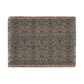 A woven cotton blanket with a geometric William Morris & Co pattern in gray, blue, and beige colours, featuring fringed edges.