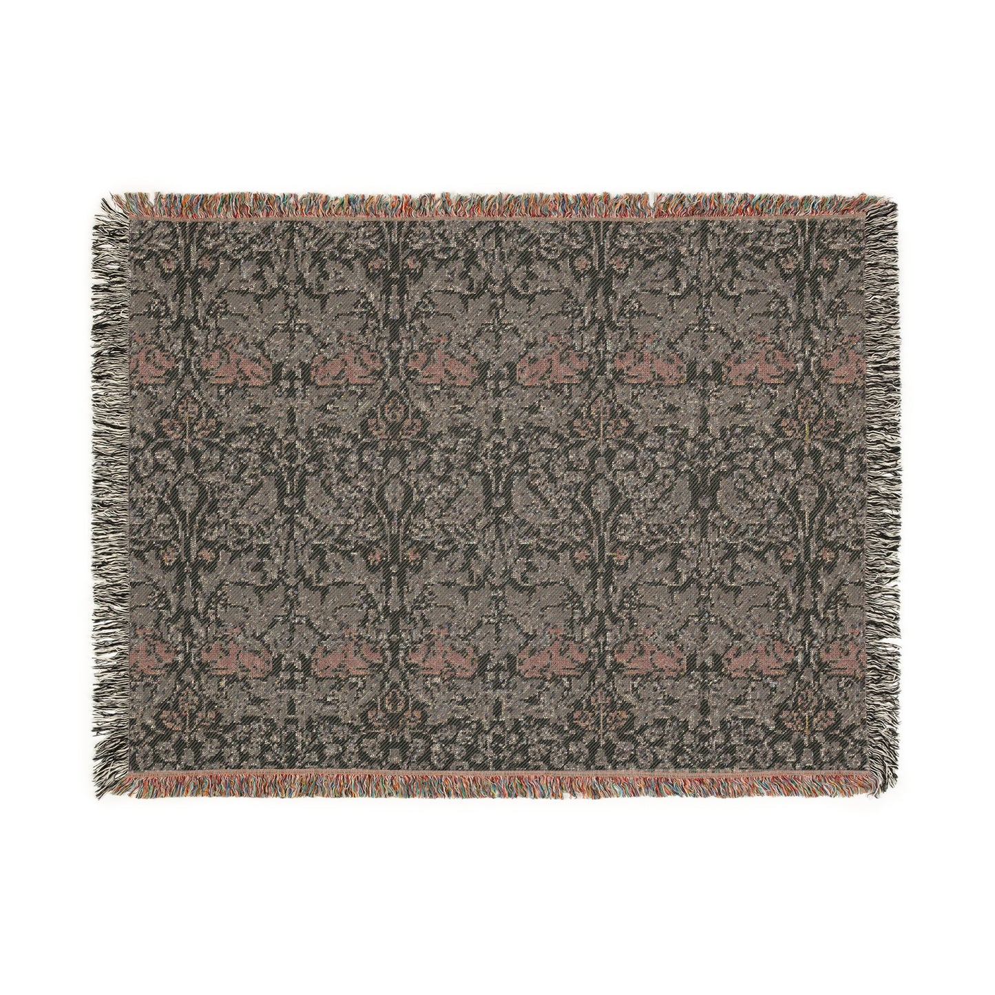 A woven cotton blanket with a geometric William Morris & Co pattern in gray, blue, and beige colours, featuring fringed edges.