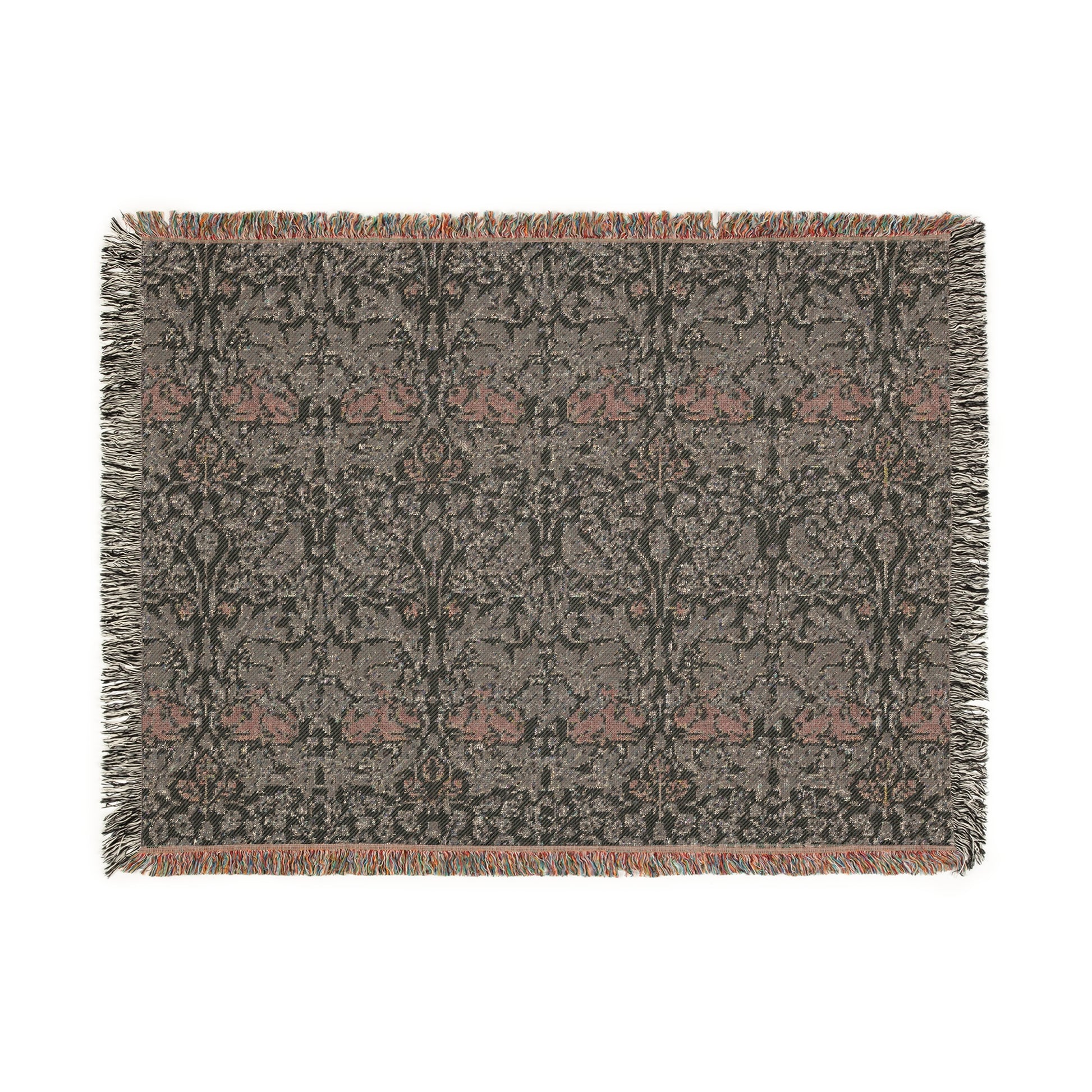 A woven cotton blanket with a geometric William Morris & Co pattern in gray, blue, and beige colours, featuring fringed edges.