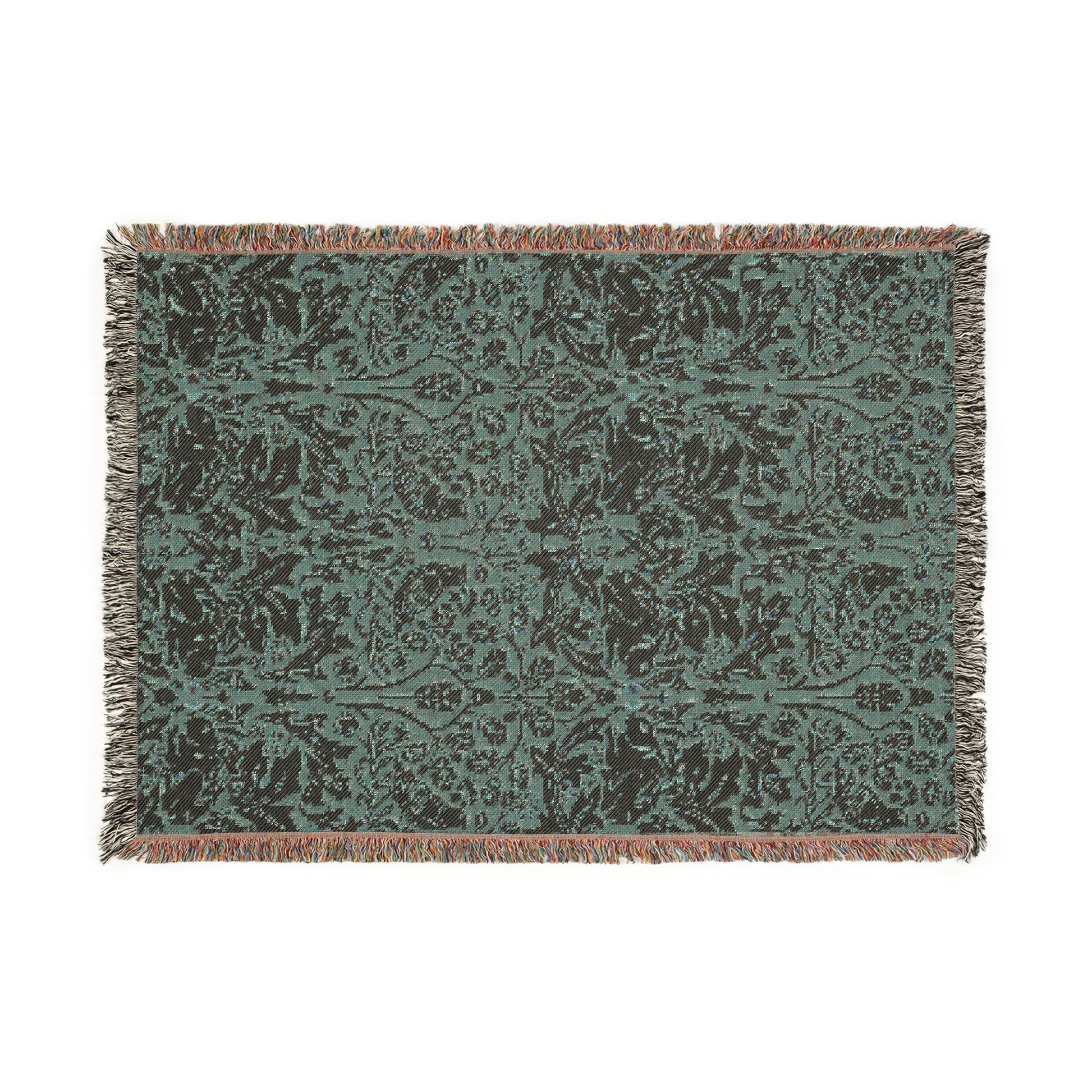 Decorative throw blanket with a floral pattern on a plain background