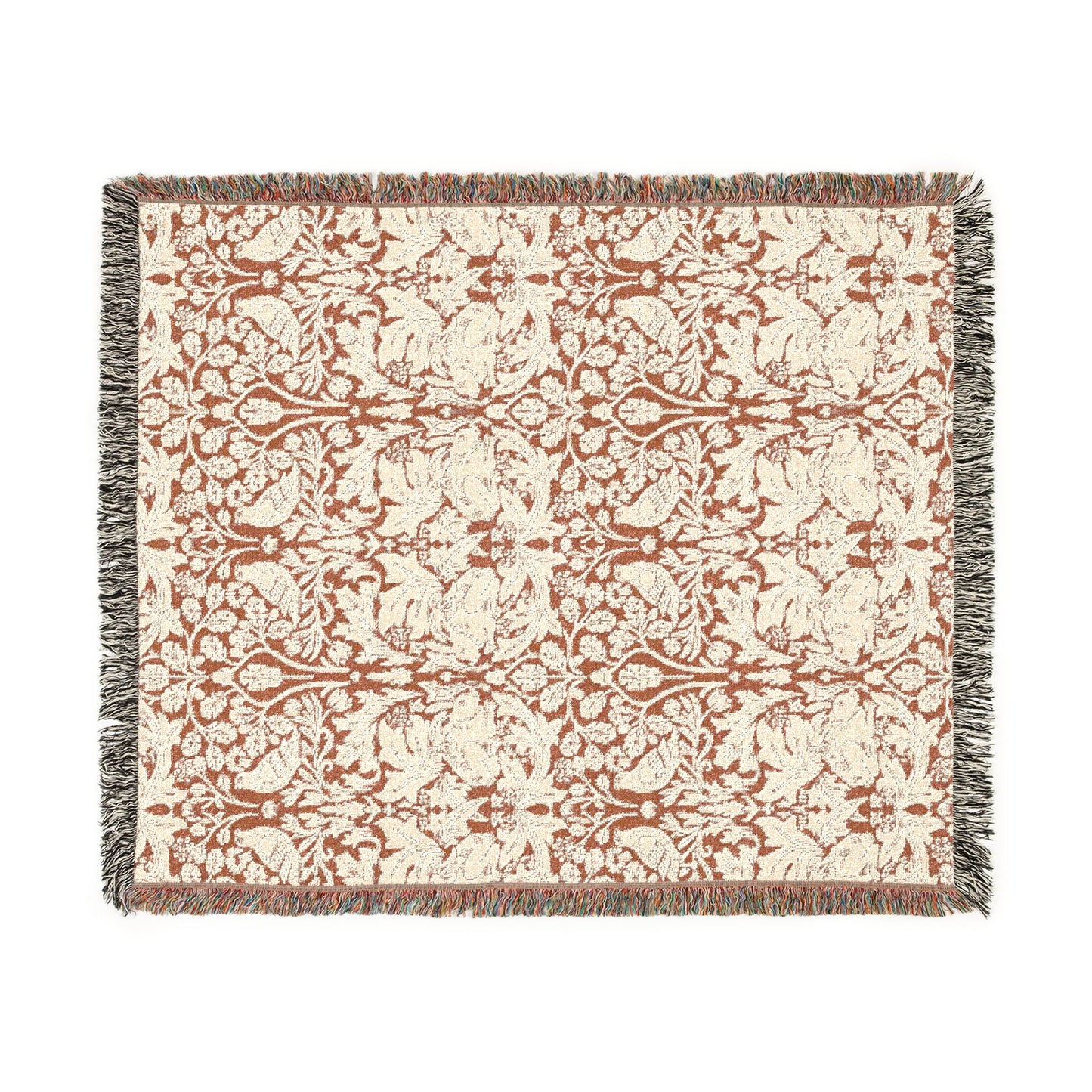 Patterned throw blanket with decorative design on a white background