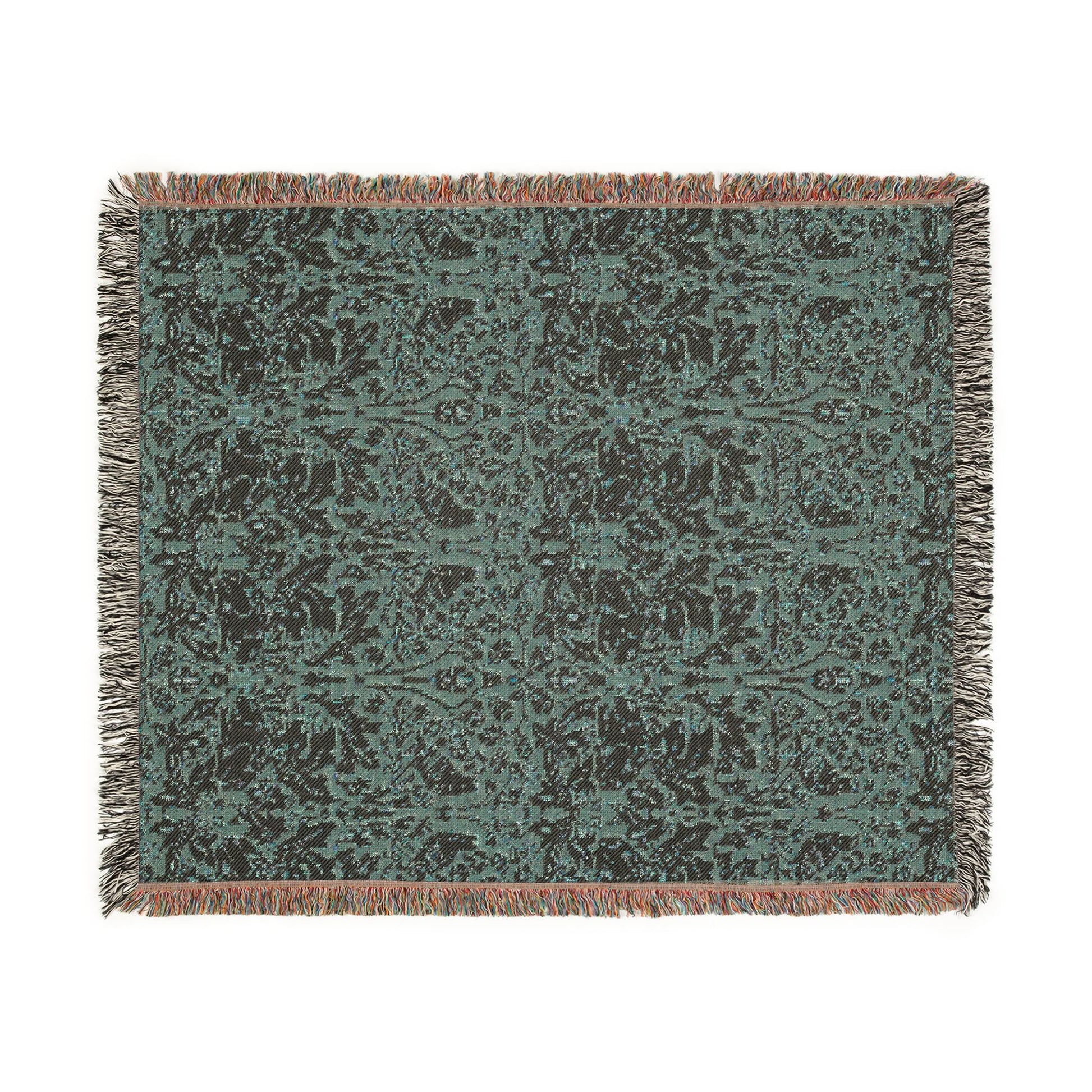Patterned throw blanket with fringes on a white background