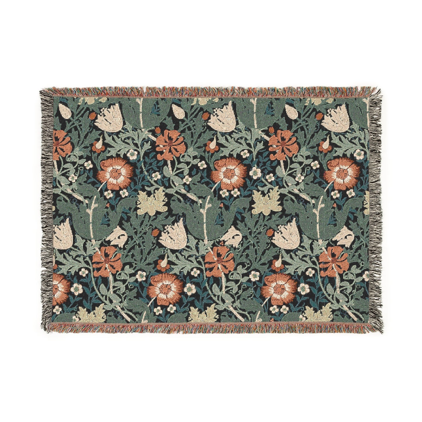 A woven cotton blanket with a William Morris & Co floral pattern in green, brown, and beige colours, featuring colourful fringed edges.