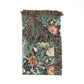 Floral patterned throw blanket with fringes on a white background