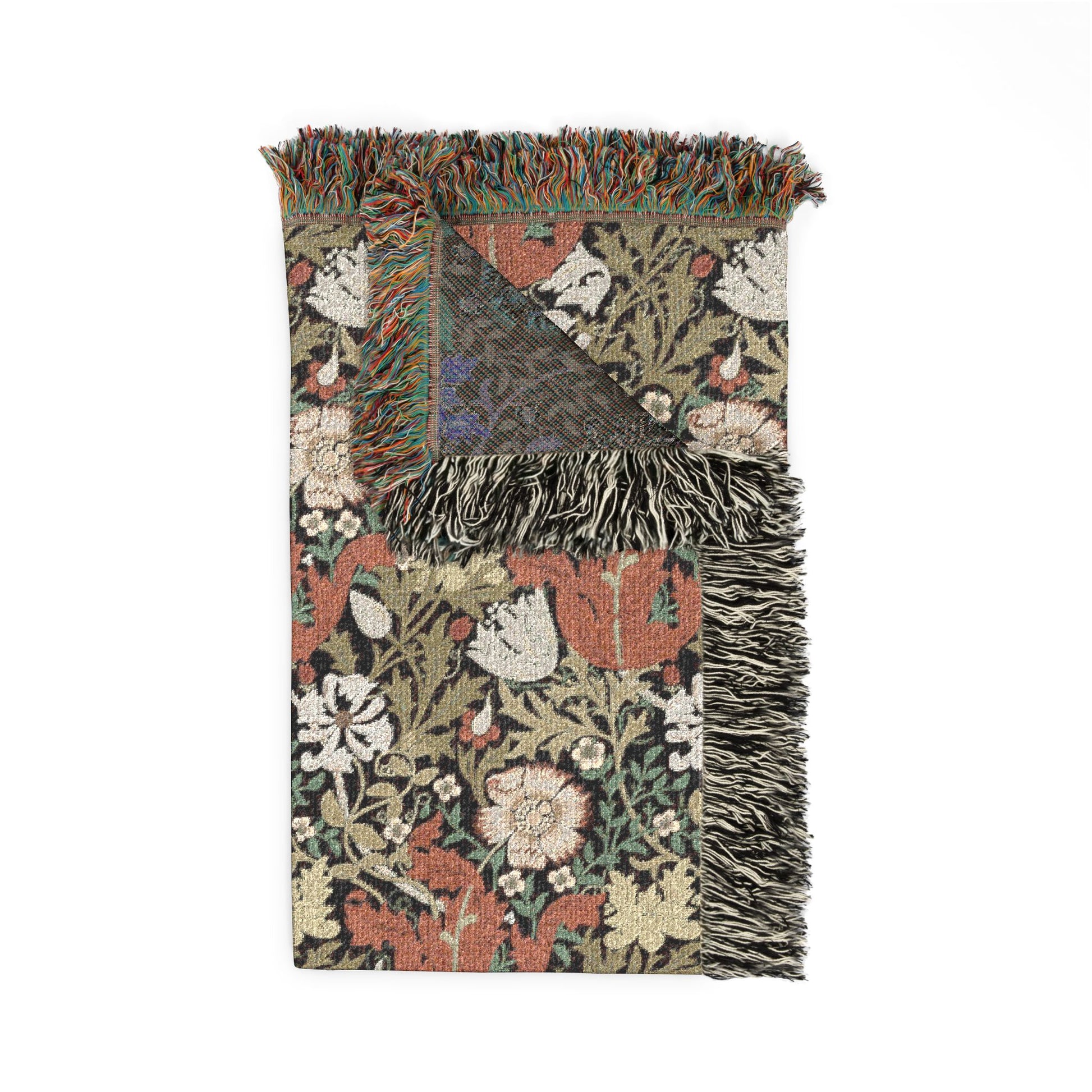 Floral patterned throw blanket with fringes on a white background