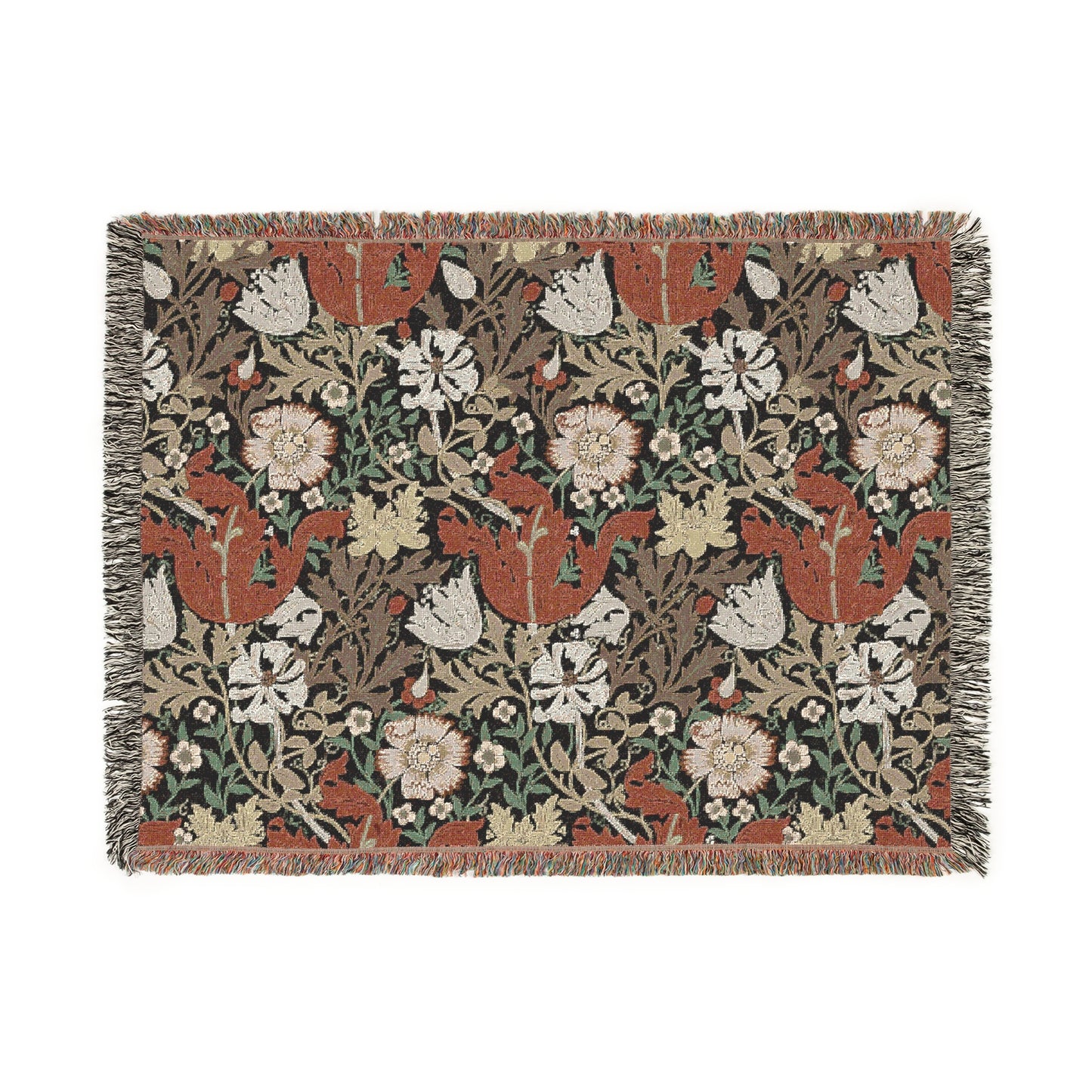 A woven cotton blanket with a geometric and floral pattern in red, green, and beige colors, with fringed edges.