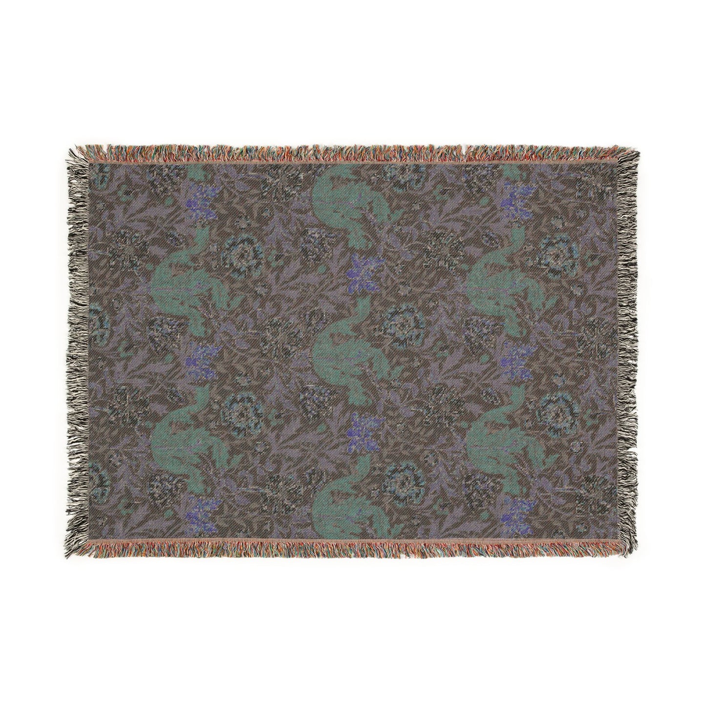 Woven blanket with a pattern of deer and flowers on a plain background