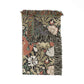 Floral patterned throw blanket with fringes on a white background