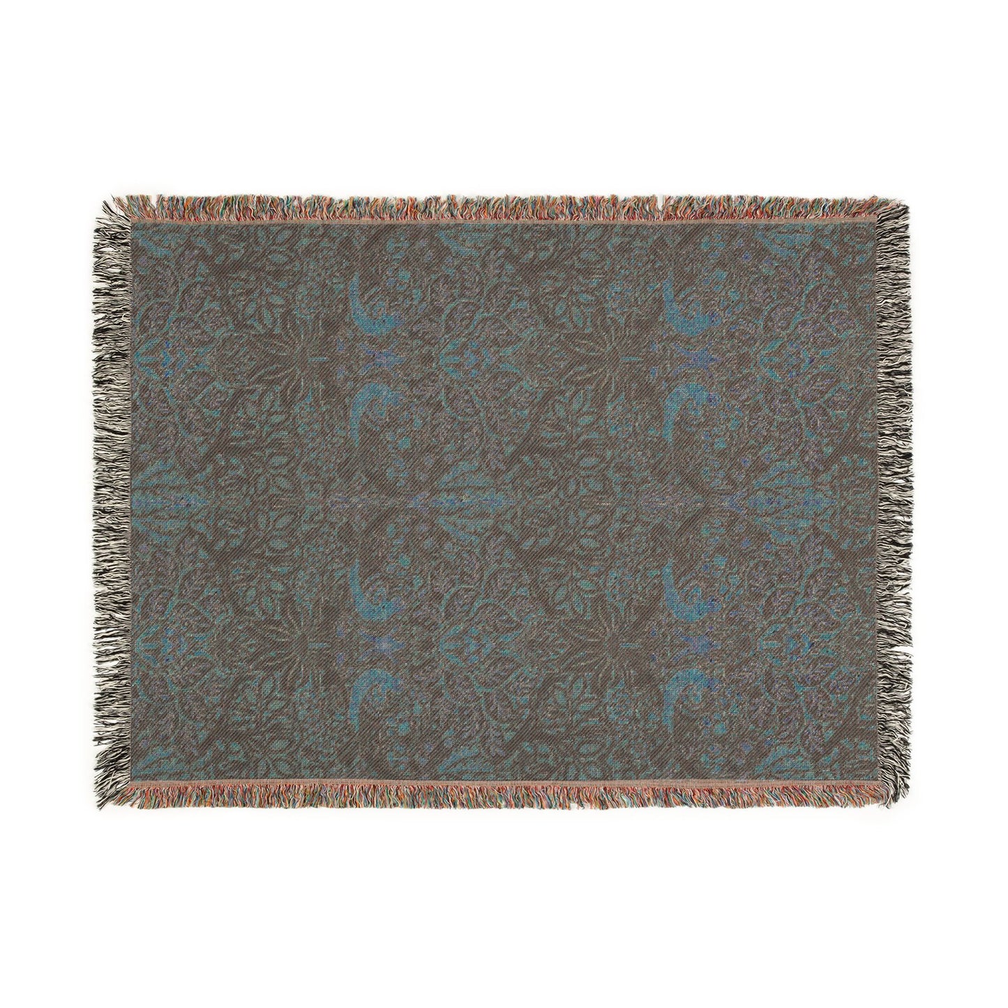 Floral patterned throw blanket with fringe on a white background
