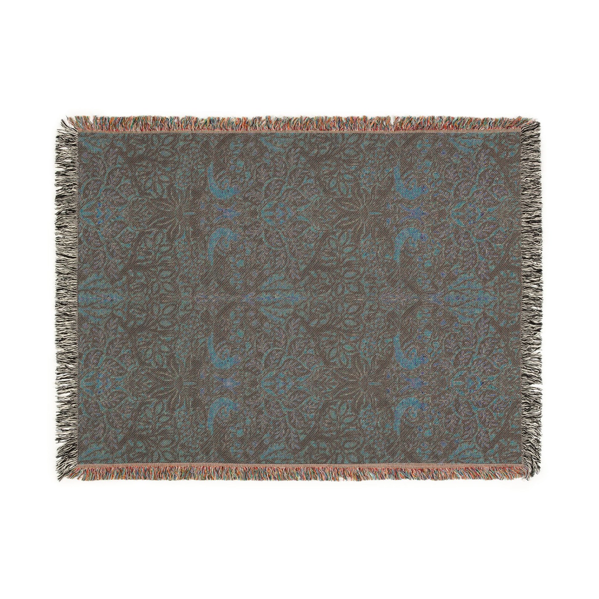 Floral patterned throw blanket with fringe on a white background