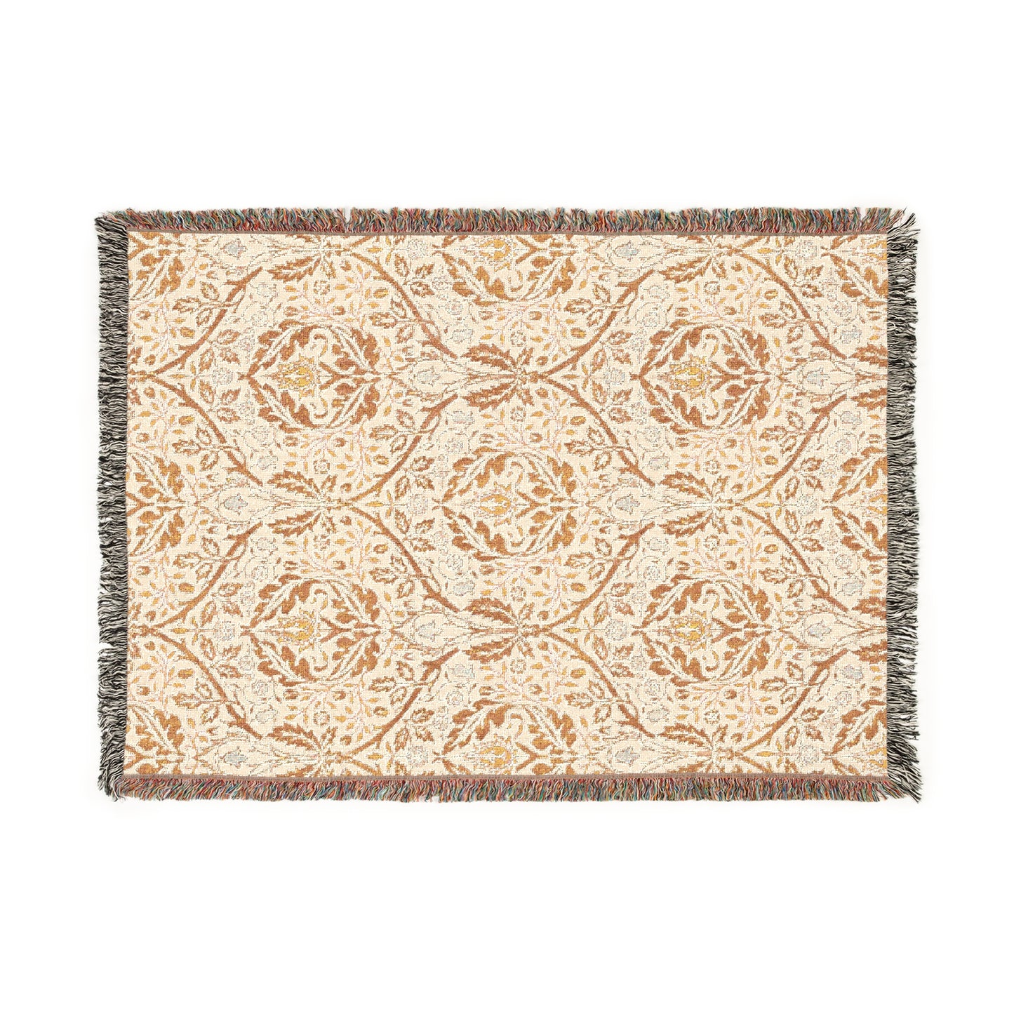 A woven cotton blanket with a geometric Willy Morris & Co pattern in beige, brown, and multicolour, with fringed edges.