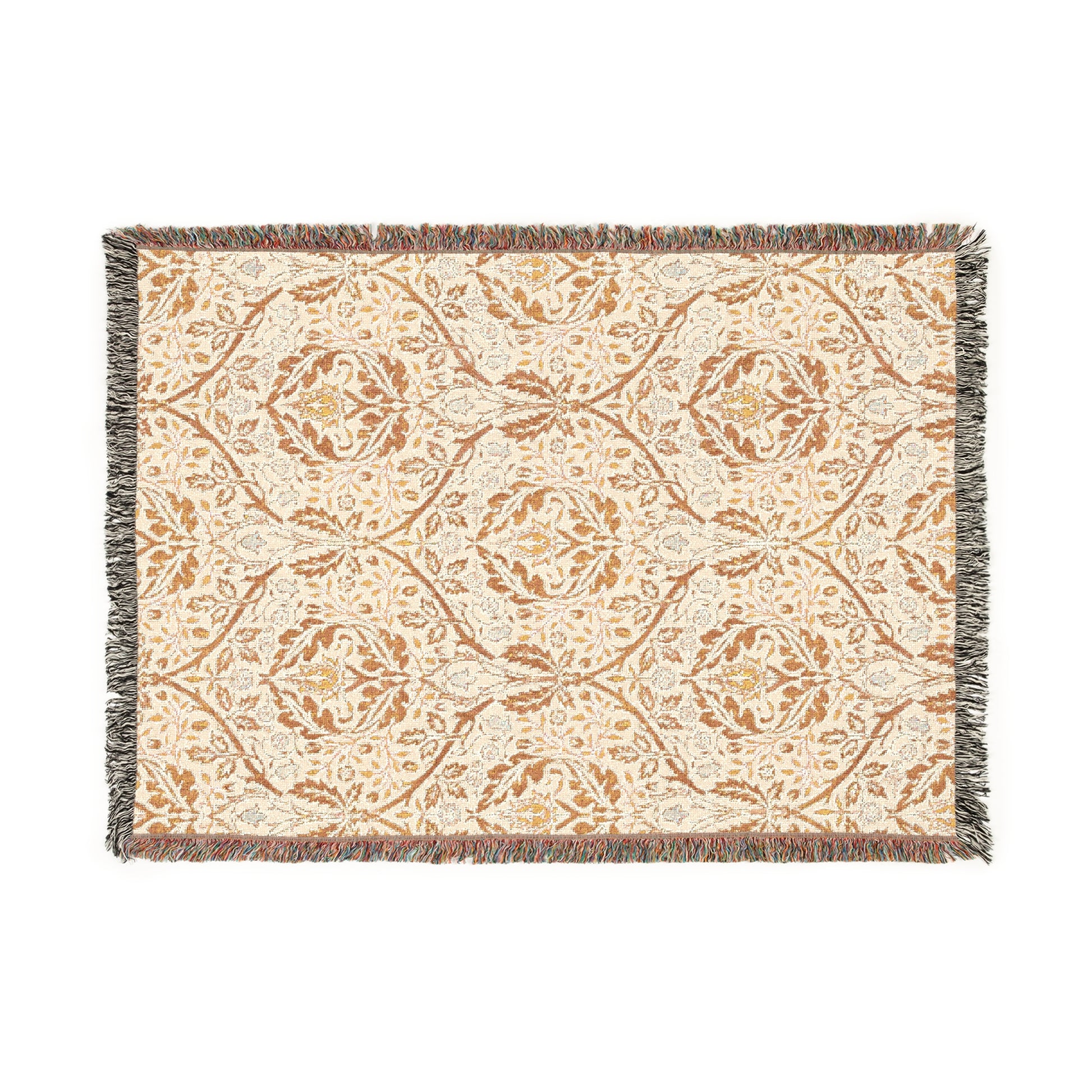 A woven cotton blanket with a geometric Willy Morris & Co pattern in beige, brown, and multicolour, with fringed edges.