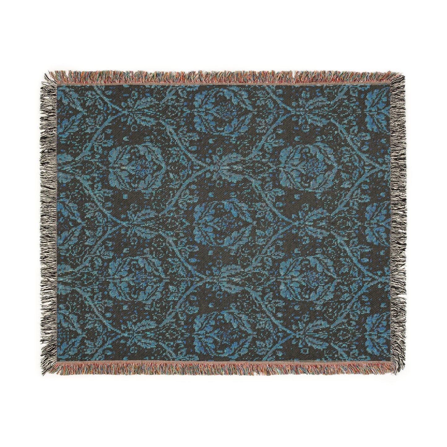 A woven cotton blanket with a geometric Willy Morris & Co pattern in beige, brown, and multicolour, with fringed edges.