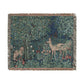 Woven tapestry with deer and nature design on a white background
