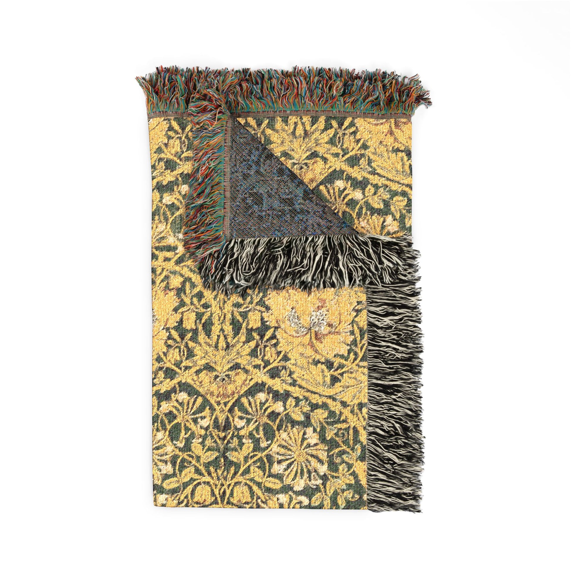 Decorative throw blanket with floral pattern and fringe on a white background