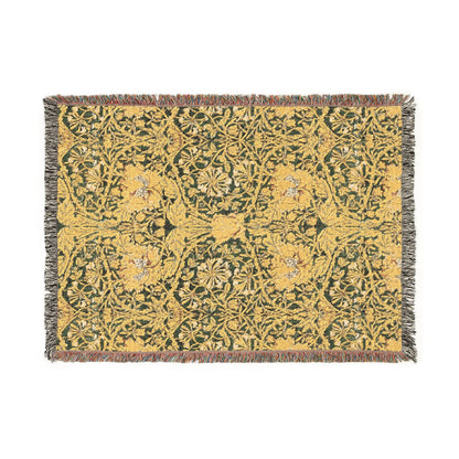 Floral patterned throw blanket with a green and yellow design on a white background