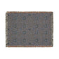 Textile with a floral pattern and fringe on a white background