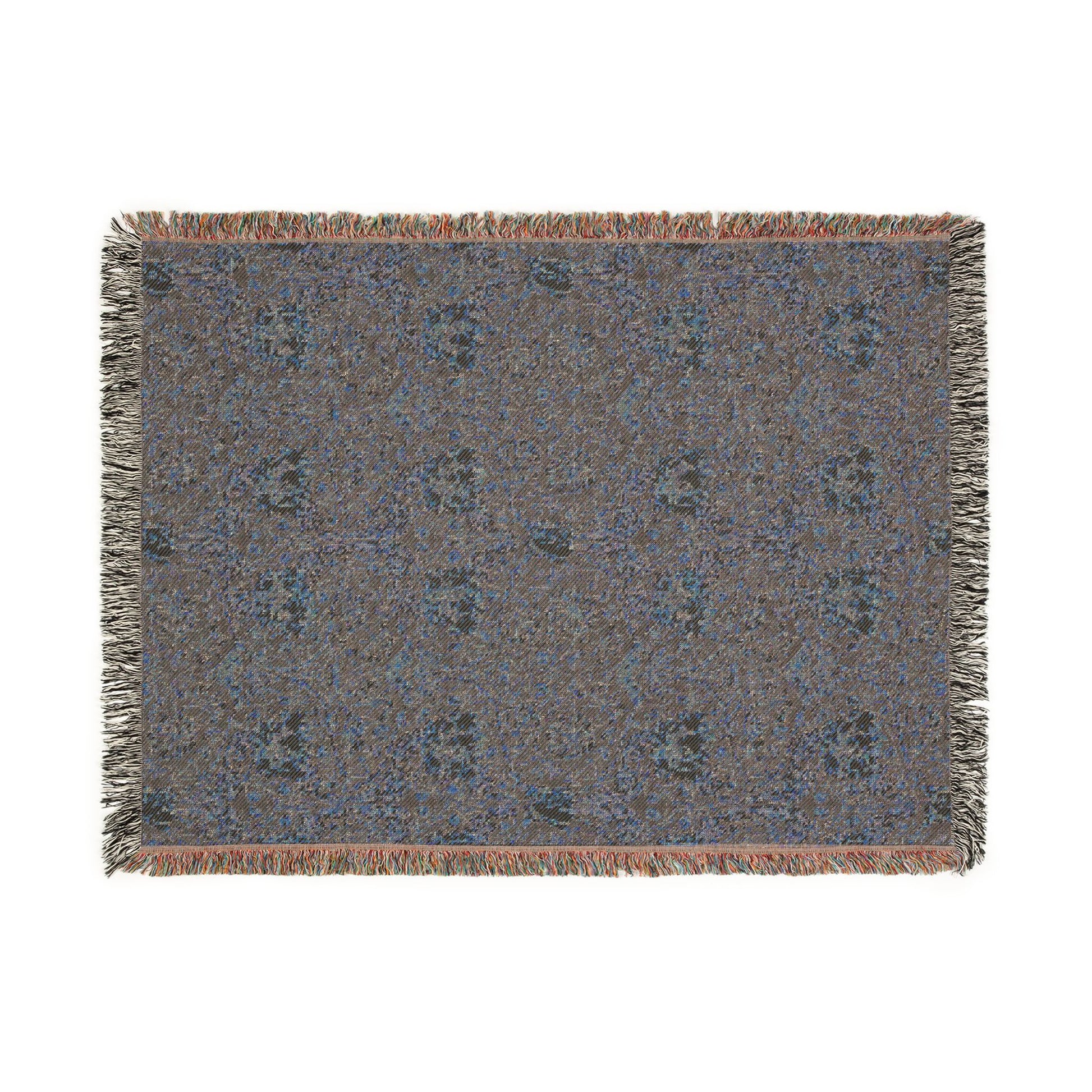Textile with a floral pattern and fringe on a white background