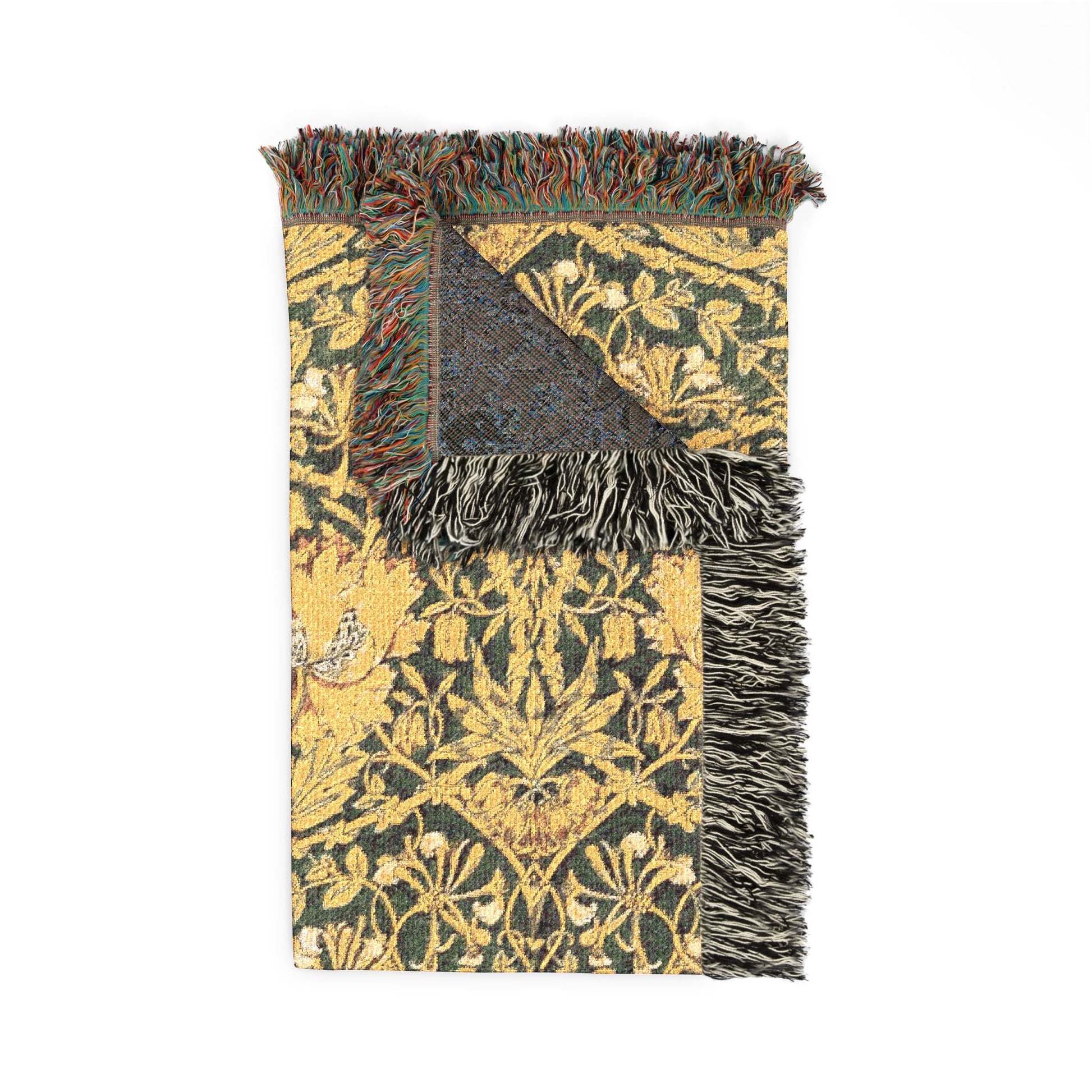 Decorative throw blanket with intricate patterns and fringes on a white background