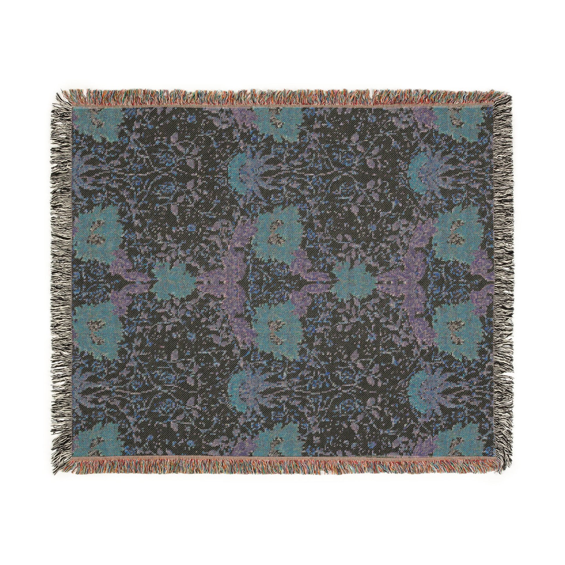 Floral patterned throw blanket with fringe on a white background