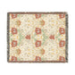 Floral patterned throw blanket with a textured border on a white background