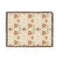Floral patterned throw blanket with fringe on a white background