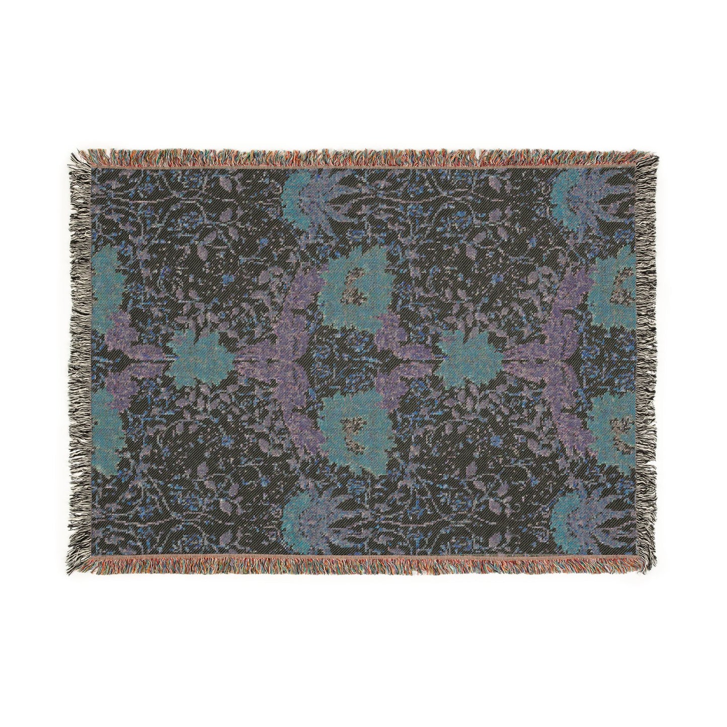 Floral patterned throw blanket with fringe on a white background
