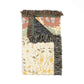 Multicolored woven rug with floral patterns and fringed edges on a white background