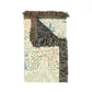 Decorative rug with floral patterns and fringed edges on a white background