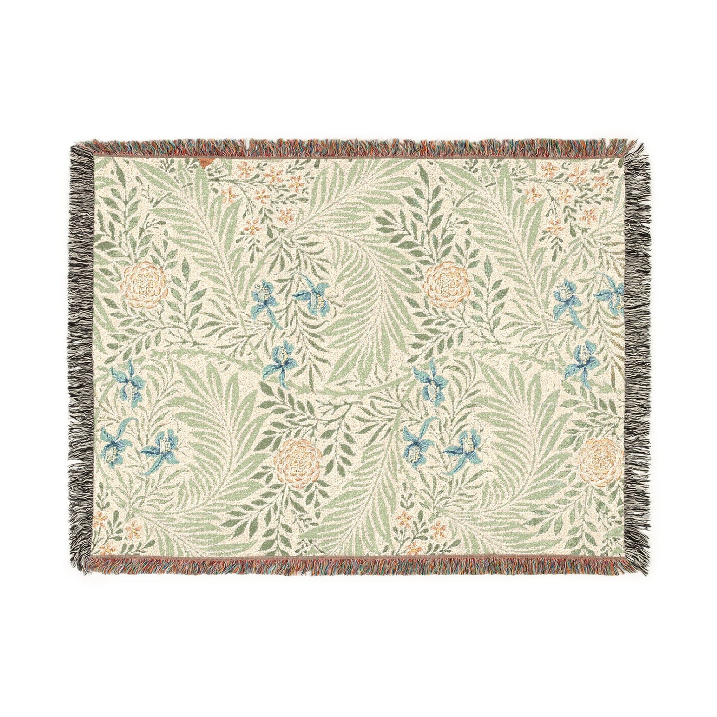 Floral patterned throw blanket with fringe on a white background