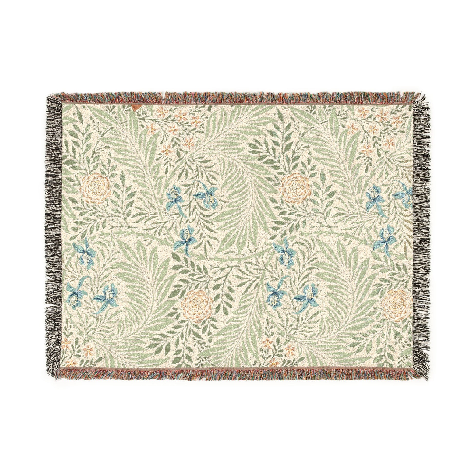 Floral patterned throw blanket with fringe on a white background