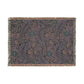 Floral patterned throw blanket with fringe on a white background