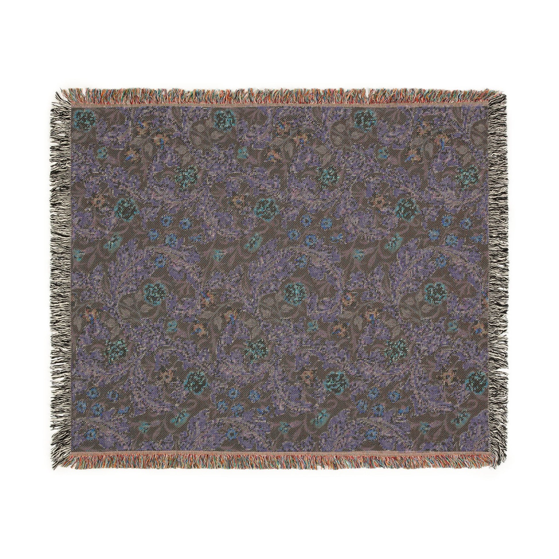 Patterned throw blanket with fringe on a white background