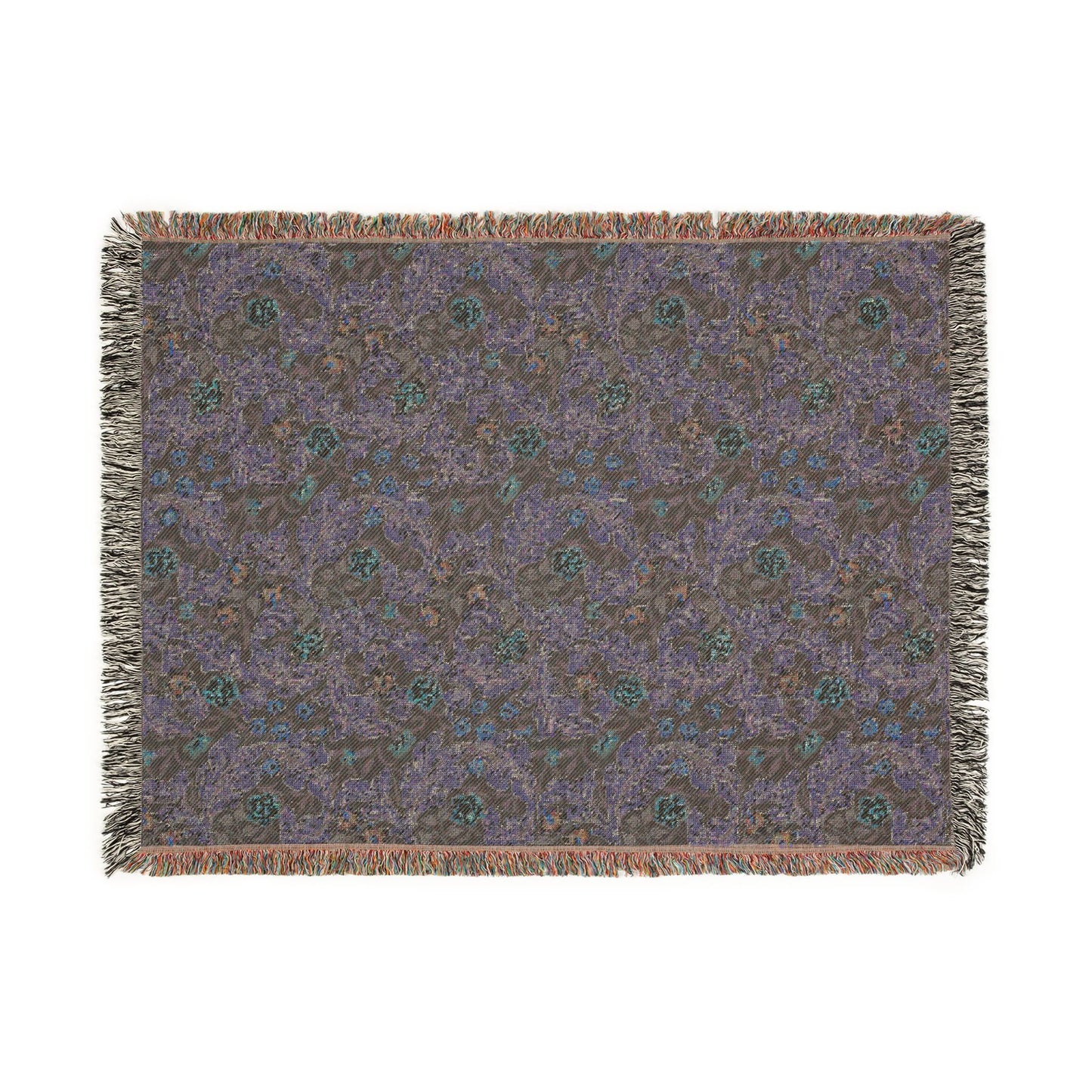 Patterned throw blanket with fringe on a white background